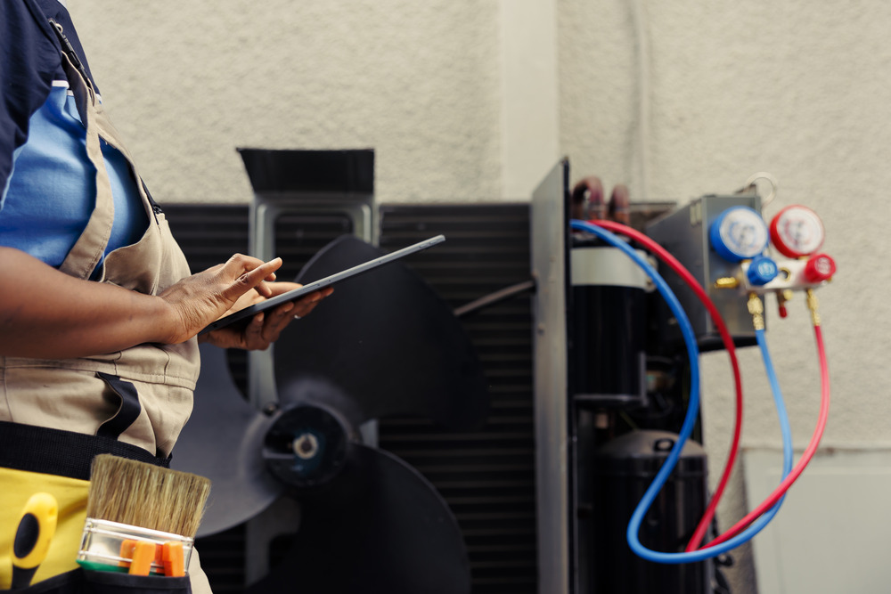 Technician Fixing Refrigerant Issues Technician Fixing Refrigerant Issues